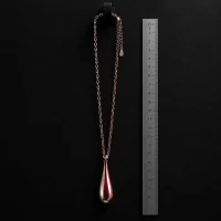 Afterglow Drop Chain, sidevinkel med lineal som skala