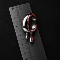Pour Cuff, vue de profil avec règle pour l'échelle