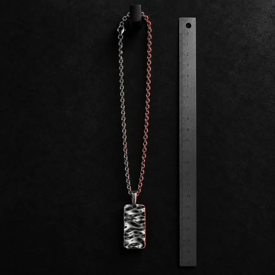 Quench Tag Chain, sidevinkel med lineal som skala
